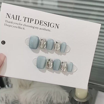 Glacier Prism product video showing icy blue press-on nails with silver mirrored crystal accents