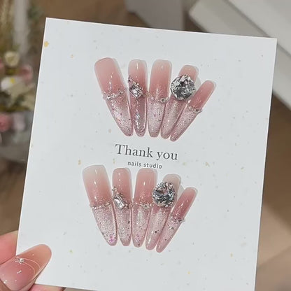 Starlit Blush product video showing blush glitter press-on nails with clear crystal accents