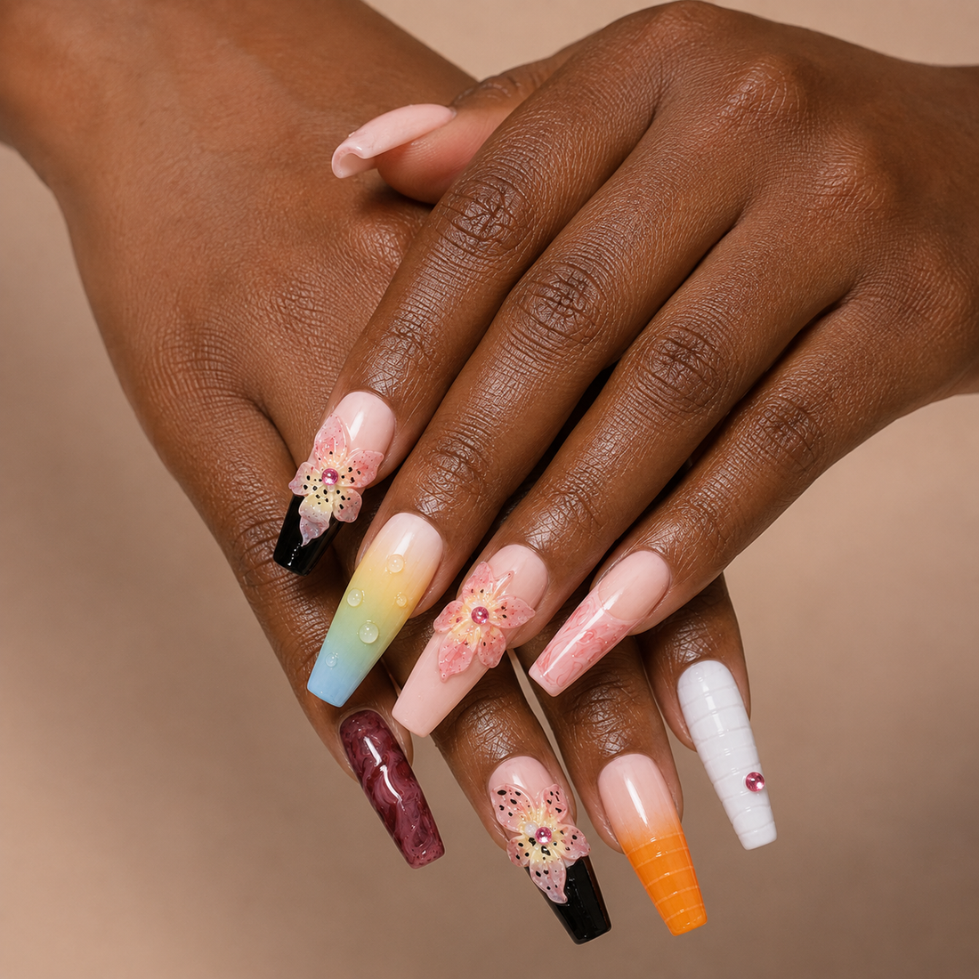 Two curled hands wearing Prism Bloom Long Stiletto press-on nails with sculpted flower petals