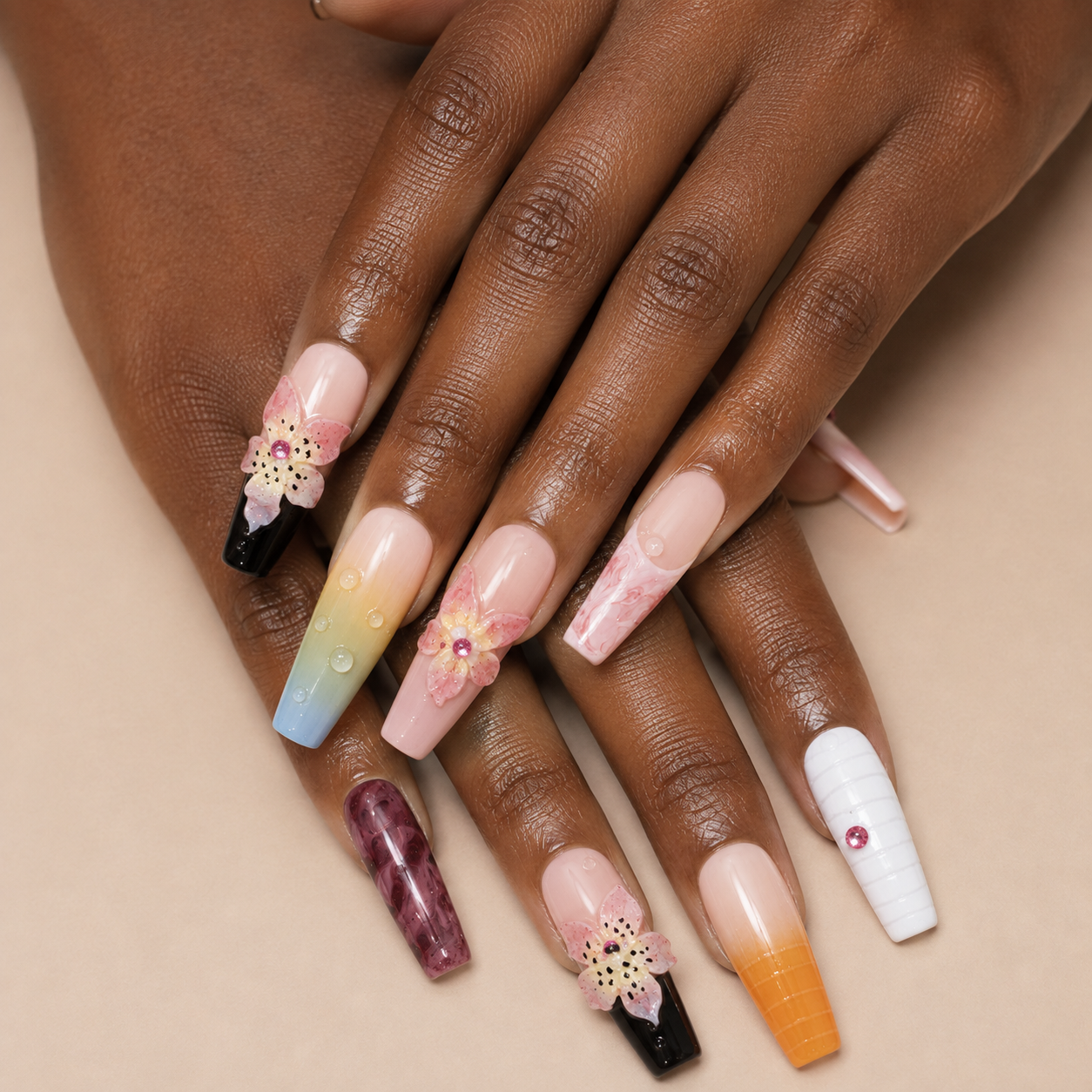 Two layered hands wearing Prism Bloom Long Stiletto multicolour floral press-on nails