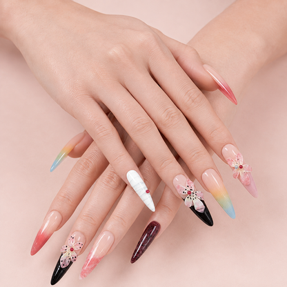 Two hands side by side wearing Prism Bloom Long Stiletto bright floral press-on nails