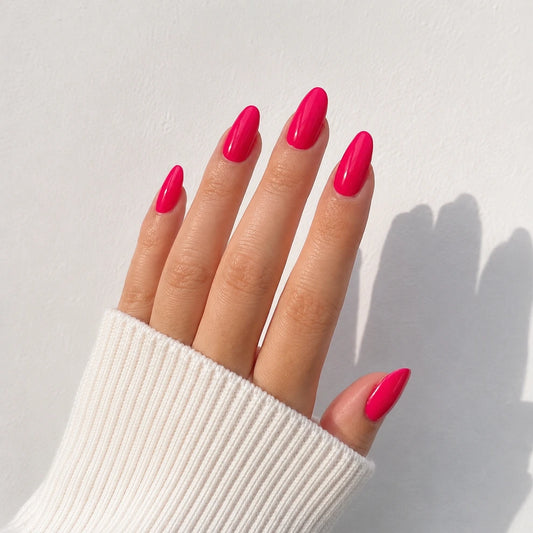 Raspberry Lacquer medium almond press-on nails by Matchy Nails