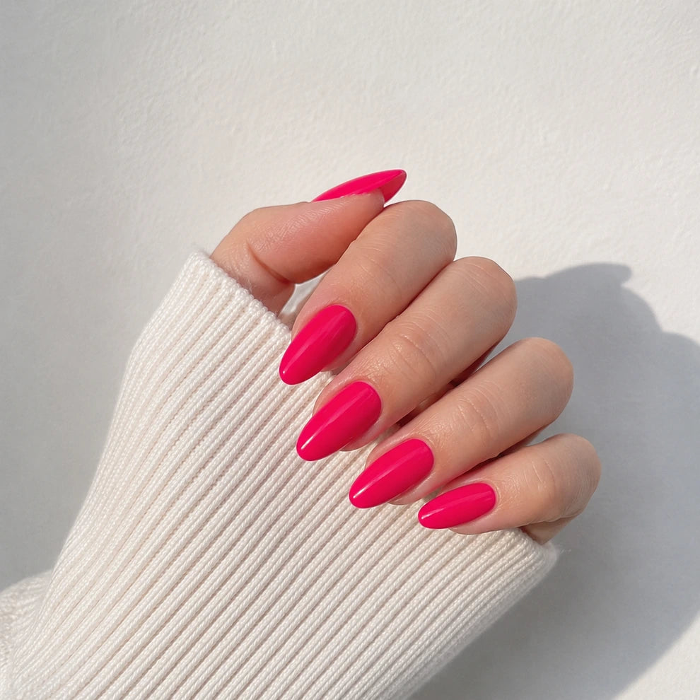 Raspberry Lacquer medium almond press-on nails by Matchy Nails