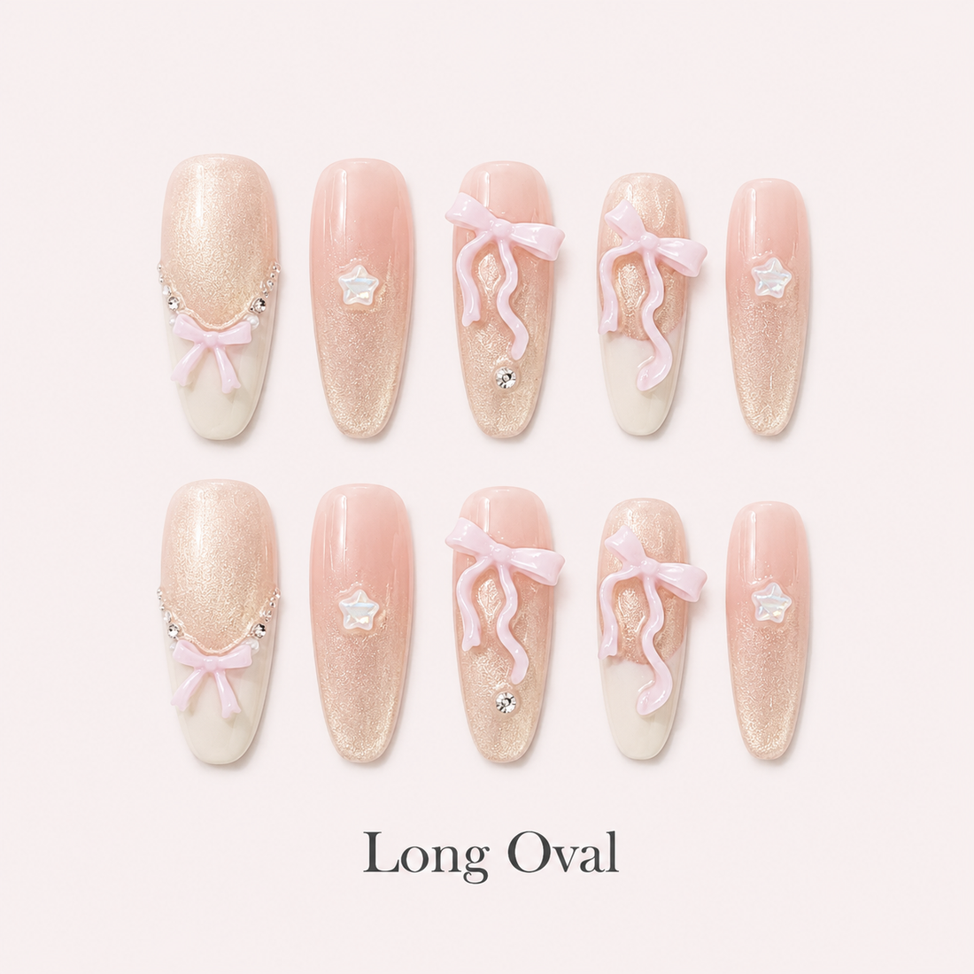 Ribbon Constellation Long Oval handmade press-on nails with blush shimmer, bows, stars and rhinestones