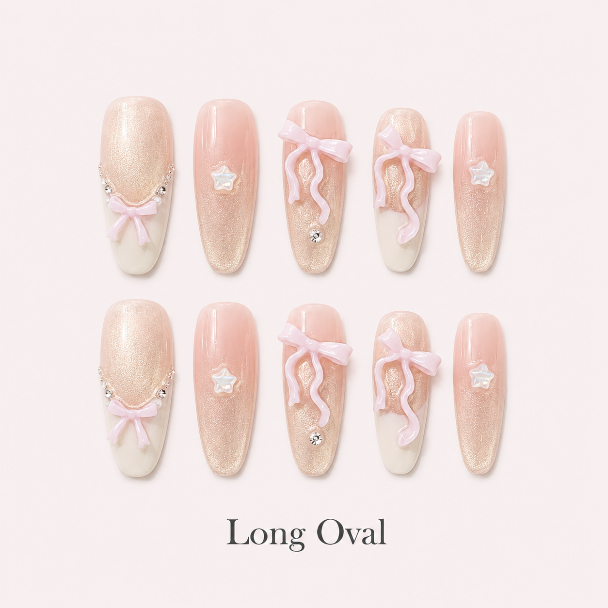 Ribbon Constellation Long Oval handmade press-on nails with blush shimmer, bows, stars and rhinestones