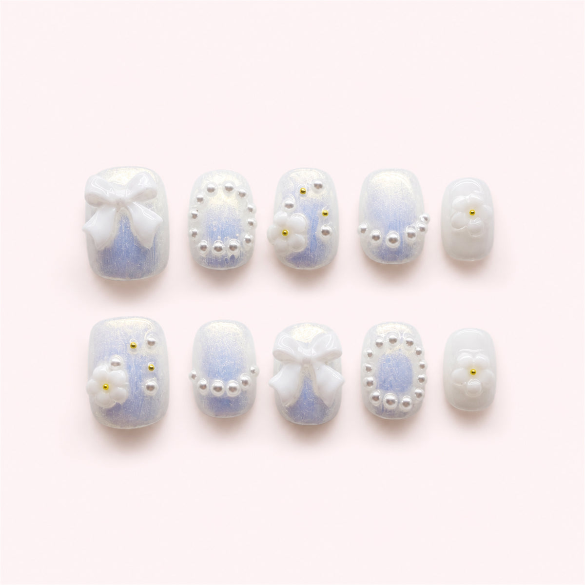 Ribbon Frost short square press-on nails on a white background.