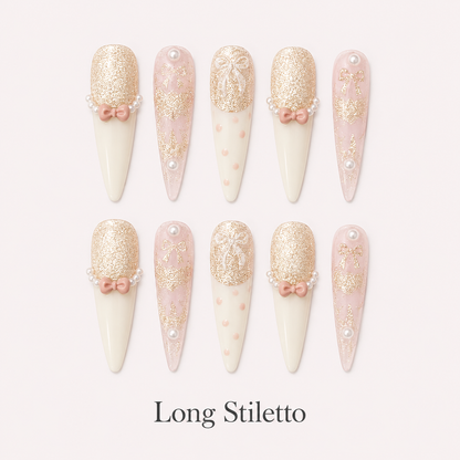 Ribbon Souffle Long Stiletto handmade press-on nails with blush French tips, bows and champagne shimmer