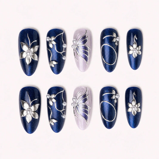 Sapphire Reverie medium almond blue cat-eye press-on nails with silver butterflies and pearls