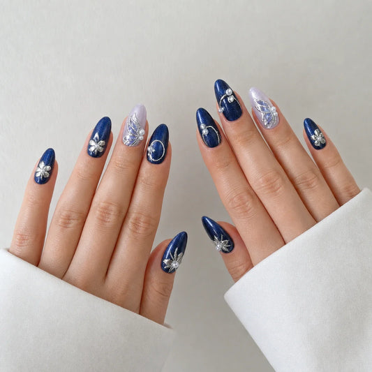 Sapphire Reverie medium almond cat-eye press-on nails on two open hands
