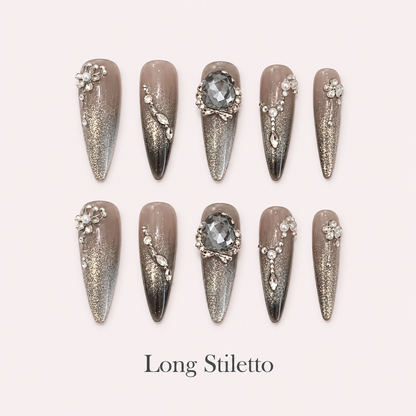 Smoky Diadem Long Stiletto press-on nails with smoky taupe, silver glitter and faceted grey crystals
