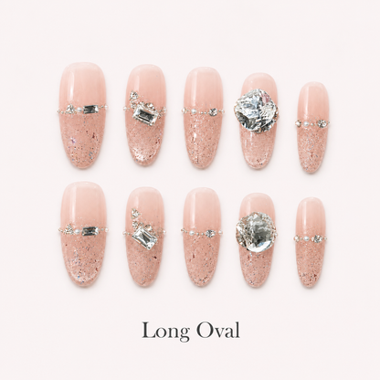 Starlit Blush Long Oval handmade press-on nails with blush glitter and clear crystal accents