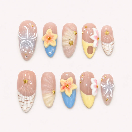 Sunlit Lagoon medium almond press-on nails in nude, yellow and blue with 3D flowers and shell details