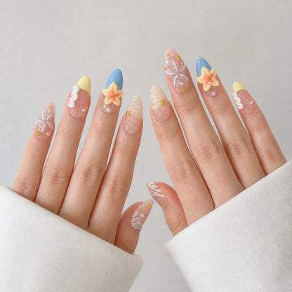 Sunlit Lagoon medium almond press-on nails on two open hands