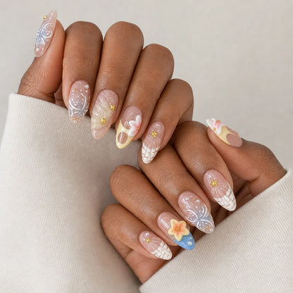 Sunlit Lagoon 3D flower and shell manicure on two medium-brown hands