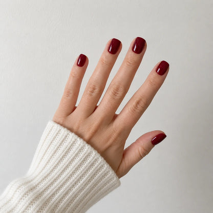 Velvet Merlot short square burgundy press-on nails in a wide open-hand view
