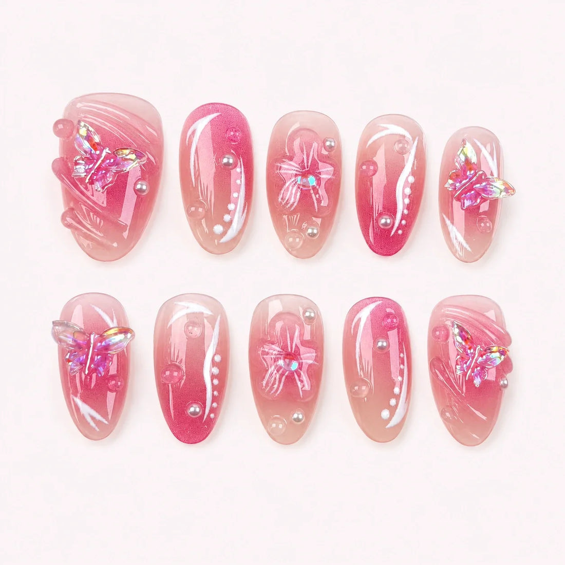 Winglight short almond press-on nails in blush-pink jelly with iridescent butterfly charms