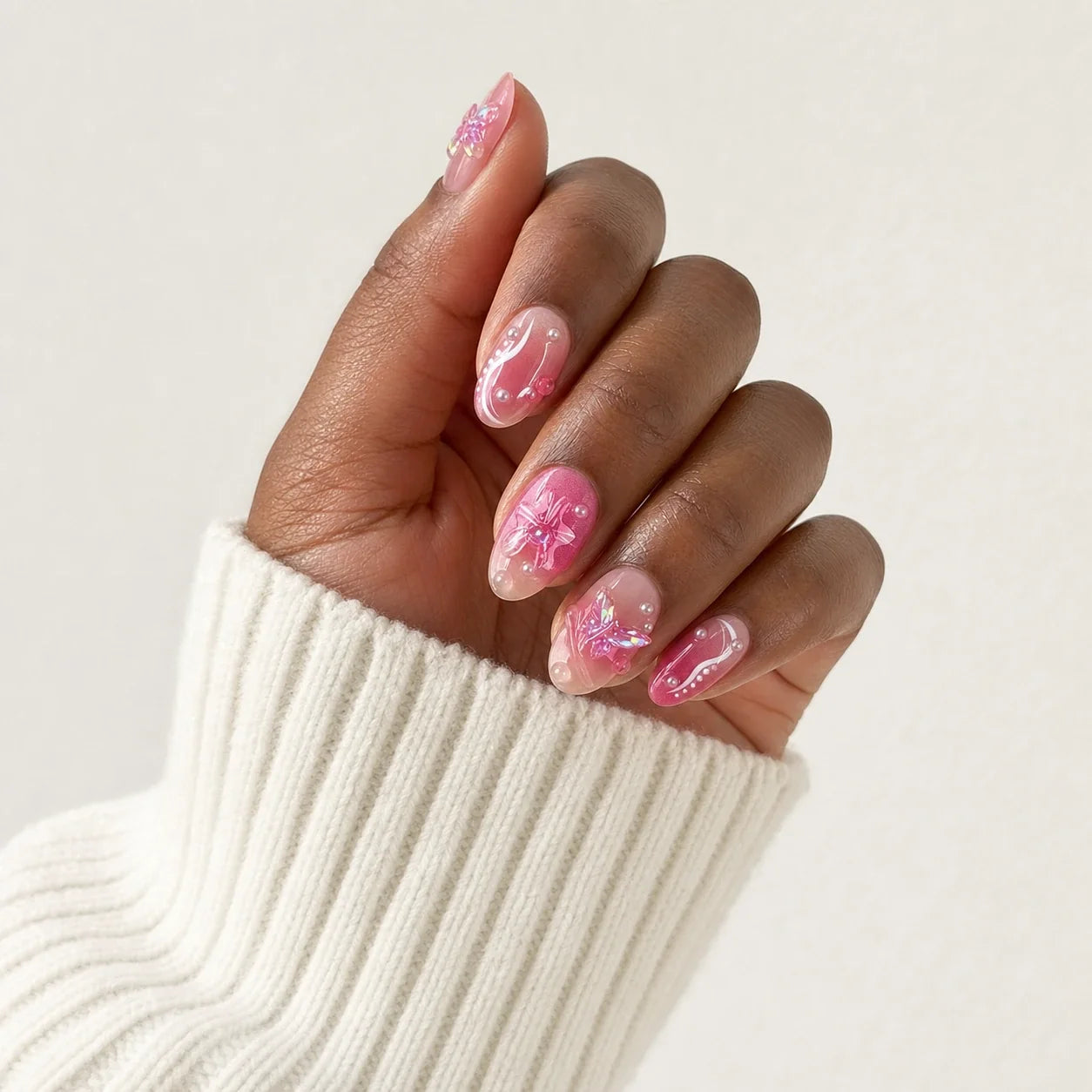 Winglight pink 3D butterfly manicure on one medium-brown hand